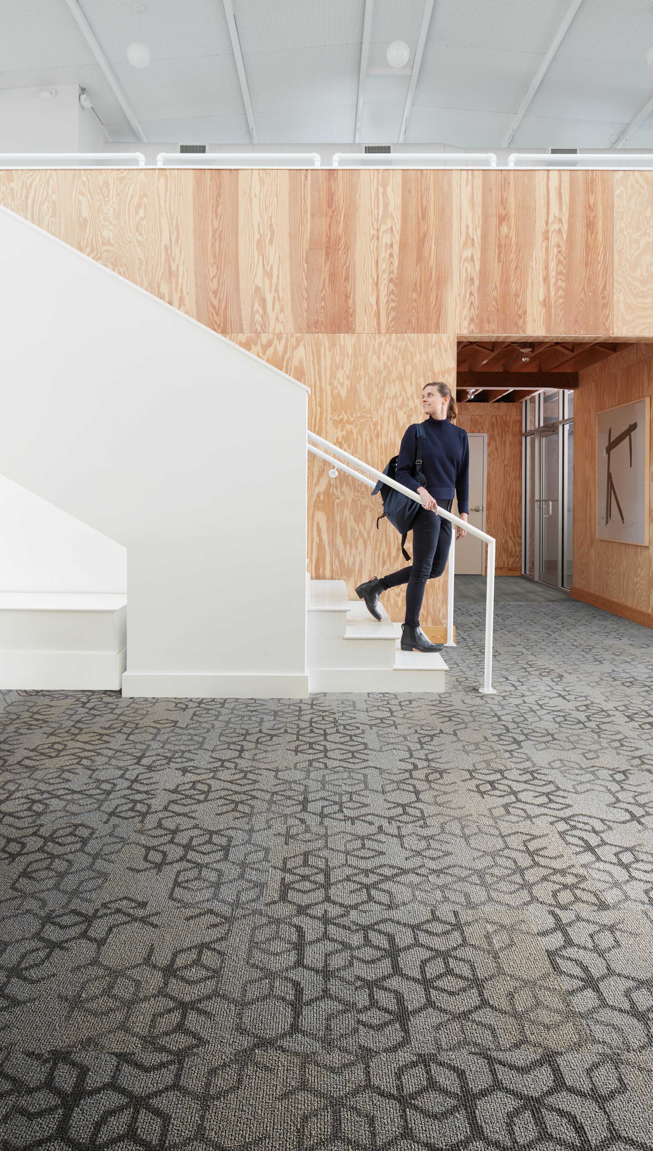 Interface Honey Do carpet tile with woman walking down open stairway and looking back image number 5